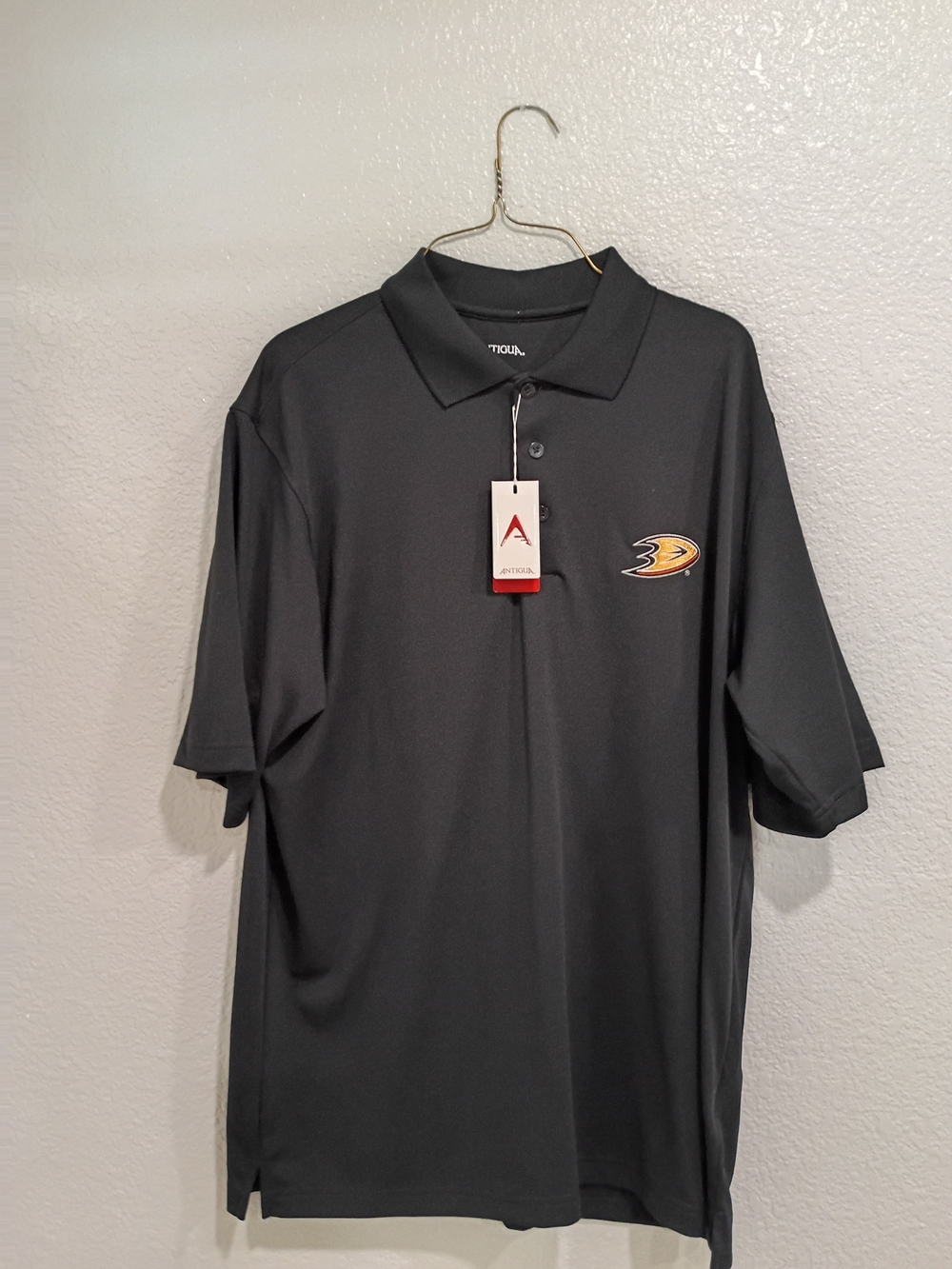 Antigua Black Polo with Anaheim Ducks Patch